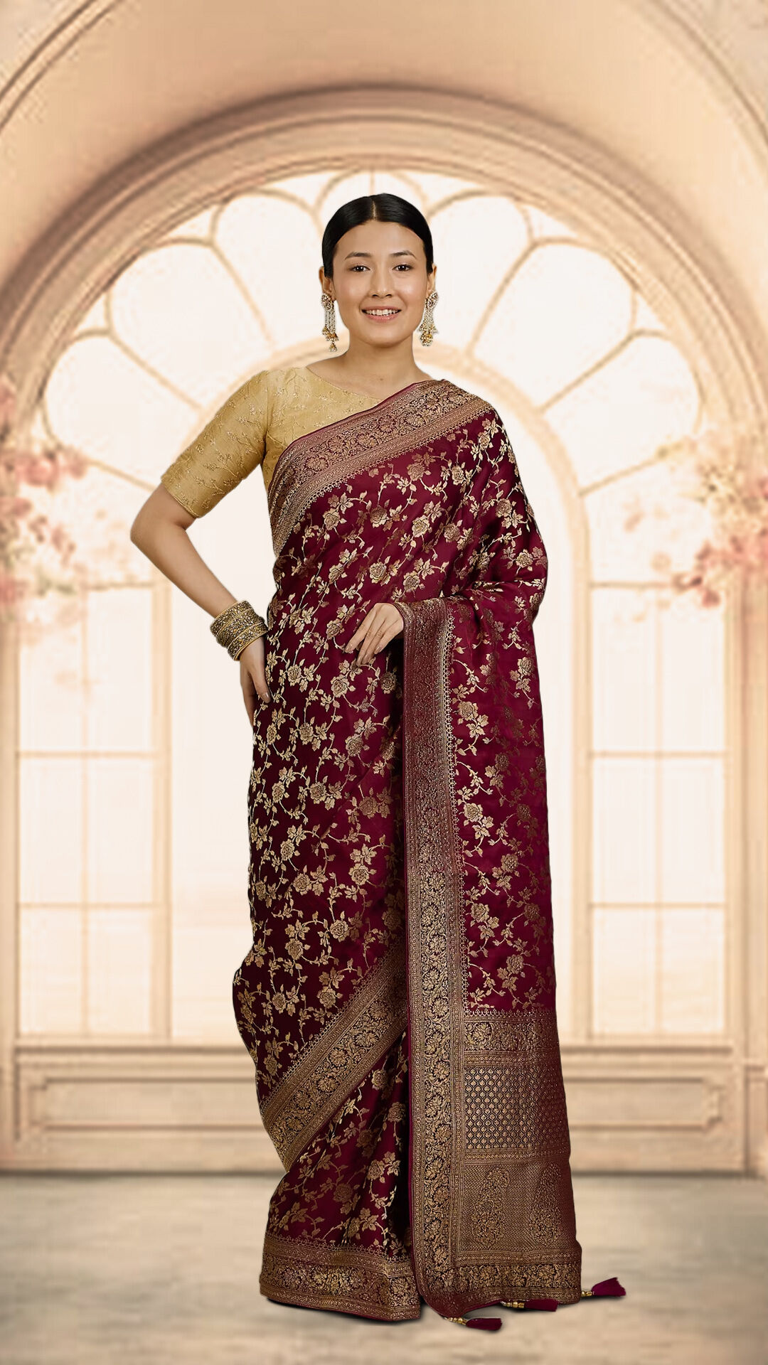 Bride in a luxurious red zari saree, exuding grace and tradition on her wedding day